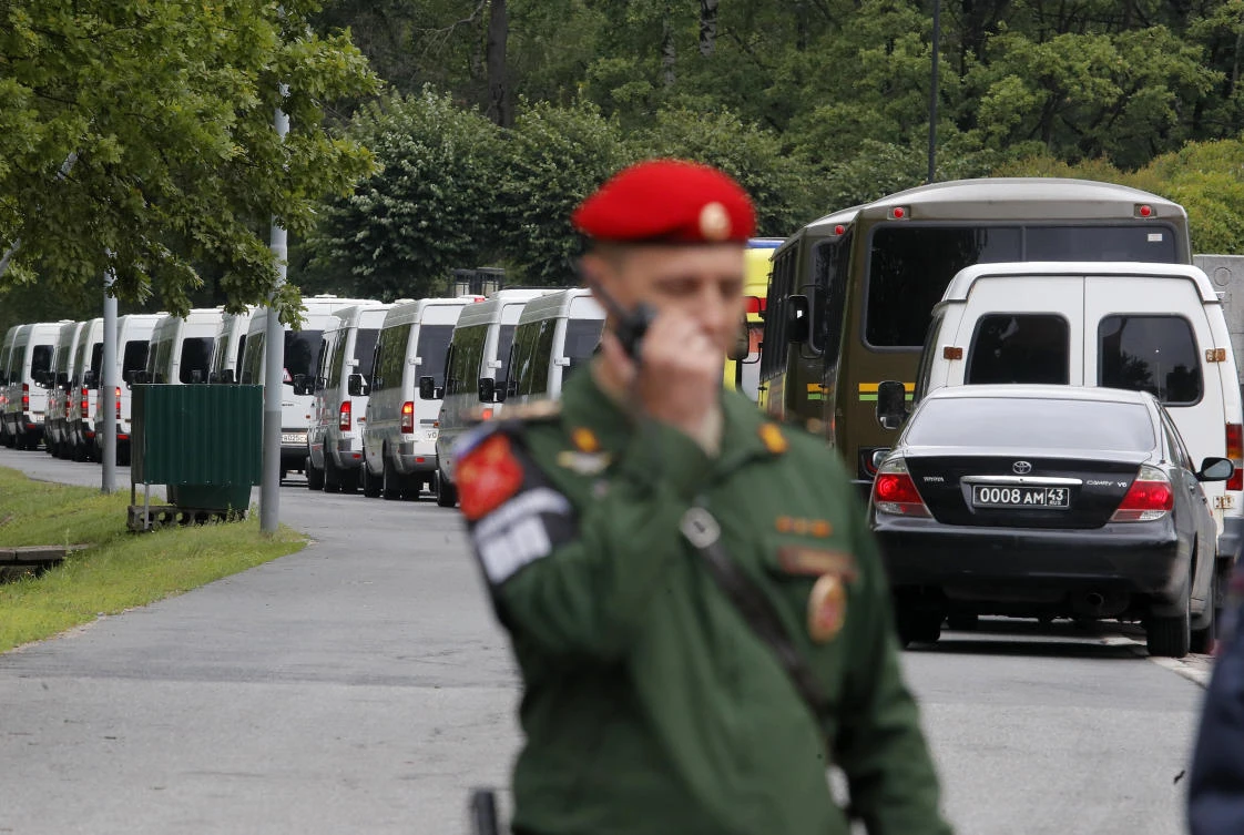 Buses carrying the bodies of crew members of a deep-sea research submersible drive to the Serafimovskoye memorial cemetery during a funeral ceremony in St. Petersburg, Russia. (AP)