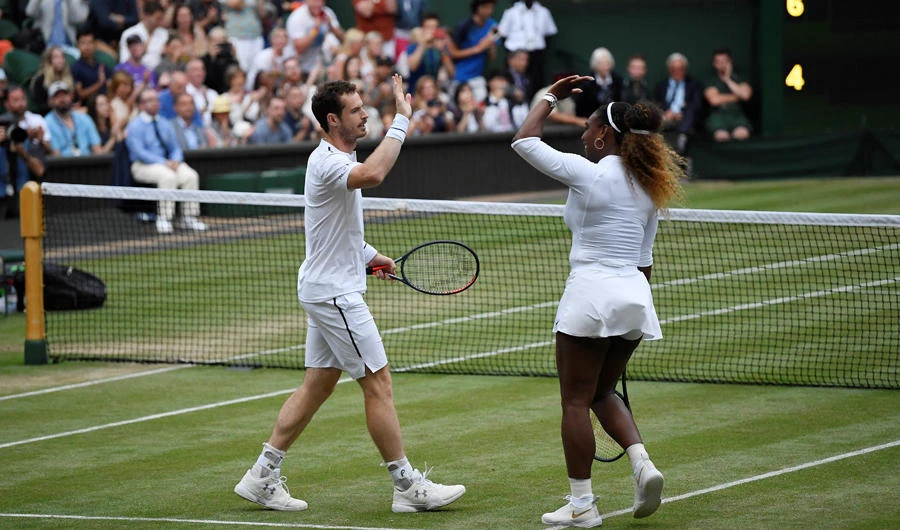 Britain's Andy Murray celebrates winning his first round mixed doubles match with Serena Williams of the US against Chile's Alexa Guarachi and Germany's Andreas Mies at the Wimbledon in London. (REUTERS/Tony O'Brien)