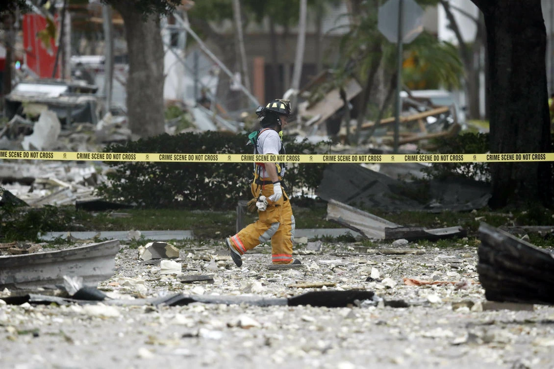 Dozens of firefighters responded to the blast that hit a vacant pizza restaurant at a South Florida shopping plaza. (AP)
