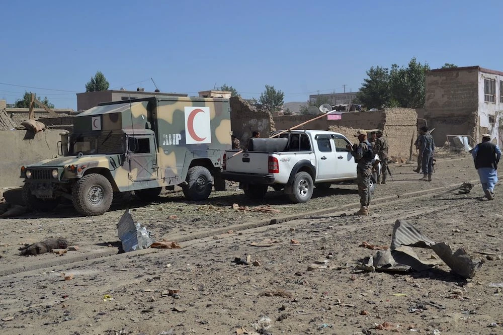 Afghan security personnel arrive at the site of a car bomb attack that targeted an intelligence unit in Ghazni on Sunday. (AFP)