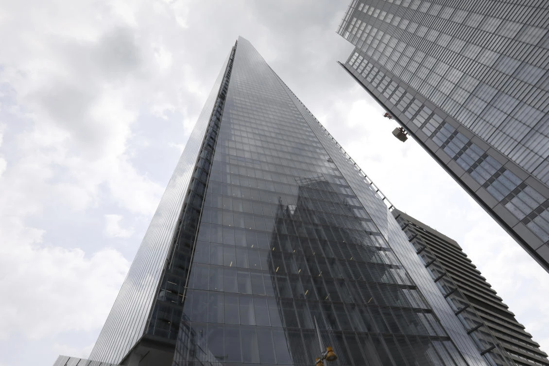 The Shard building, one of the tallest buildings in Europe, reaches up from the city of London, Monday, July, 8, 2019. A free climber, no name released by police, scaled The Shard without safety equipment, earlier Monday. (AP)