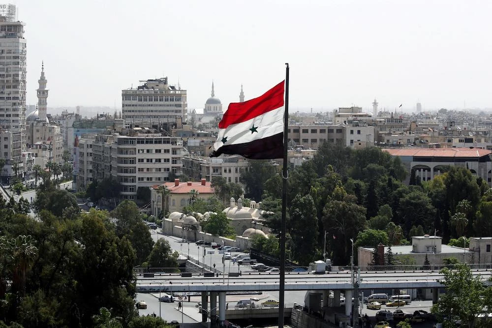 A Syrian flag flutters in Damascus, Syria. (File/Reuters)