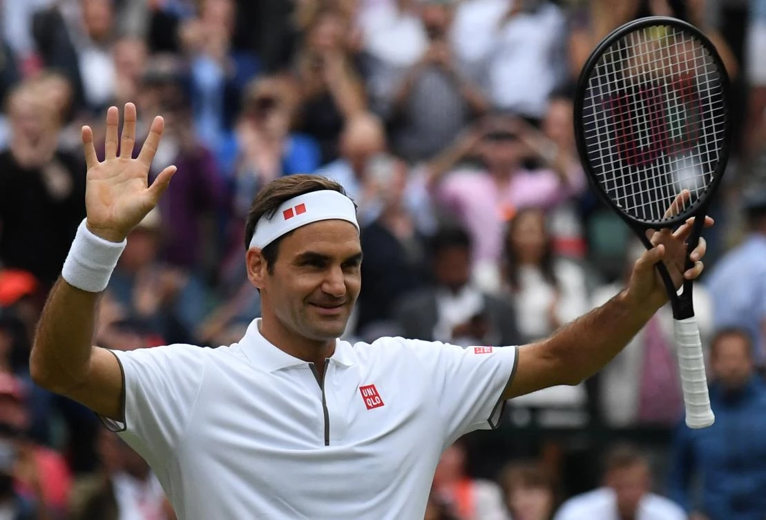 Federer into 17th Wimbledon quarter-final with 99th win at tournament