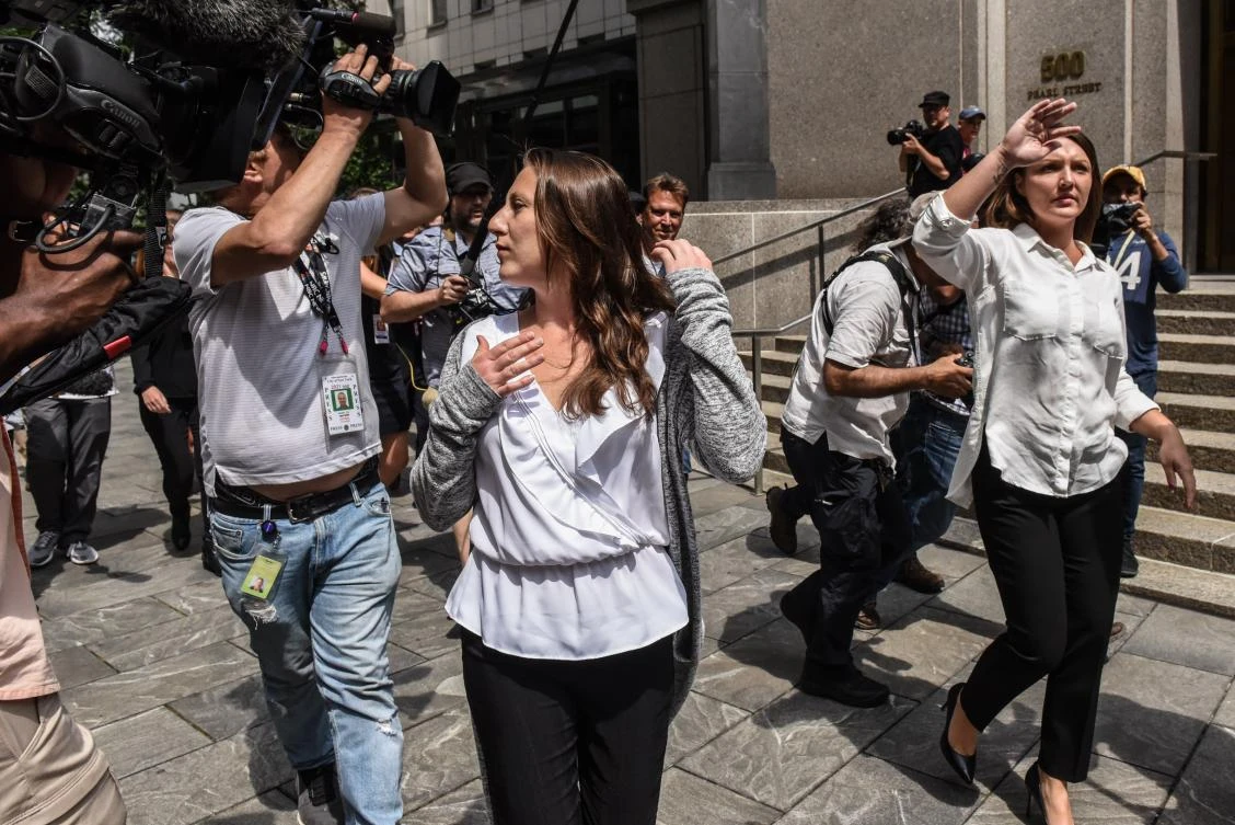 Two of Jeffrey Epstein's alleged victims, Michelle Licata (L) and Courtney Wild (R), exit the courthouse after the billionaire financier appeared for a hearing on July 8, 2019 in New York City. (AFP)