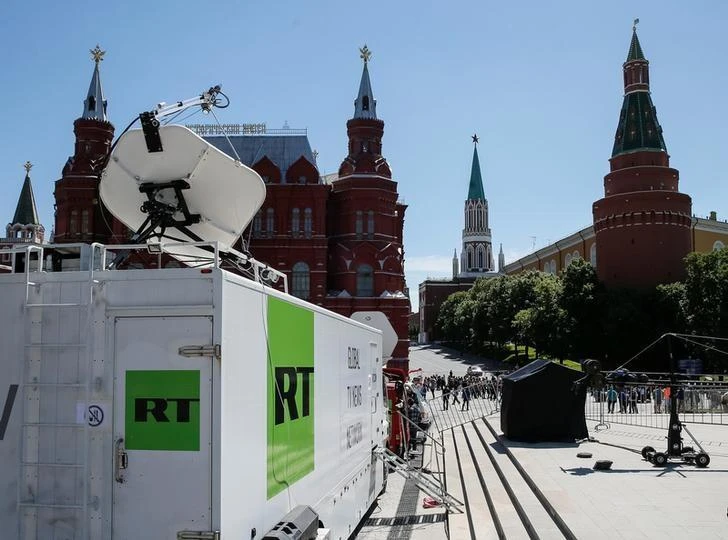 Vehicles of Russian state-controlled broadcaster Russia Today (RT) near Red Square, Moscow. (Reuters)