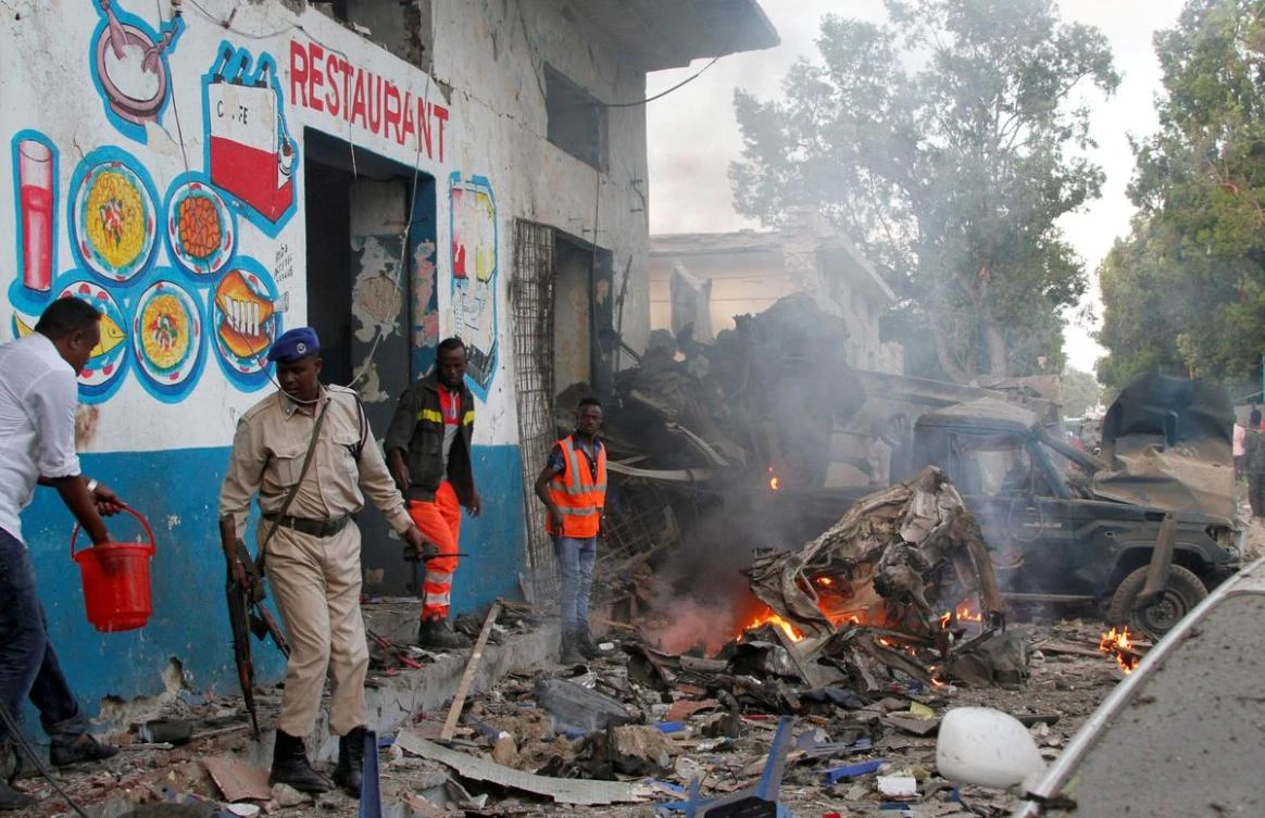 Somali security officers secure the scene of a suicide car bomb explosion, at the gate of Naso Hablod Two Hotel in Hamarweyne district of Mogadishu, Somalia October 28, 2017. (Reuters)