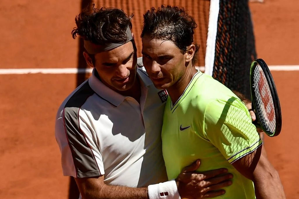 Rafael Nadal, right, Roger Federer after winning their men’s singles semi-final match of The Roland Garros 2019 French Open tennis tournament in Paris on June 7, 2019. (AFP file photo)