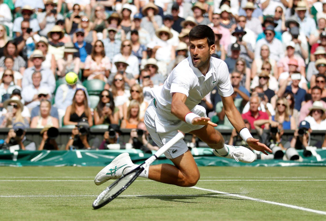Serbia's Novak Djokovic in action during his Wimbledon semifinal match against Spain's Roberto Bautista Agut. (Reuters)