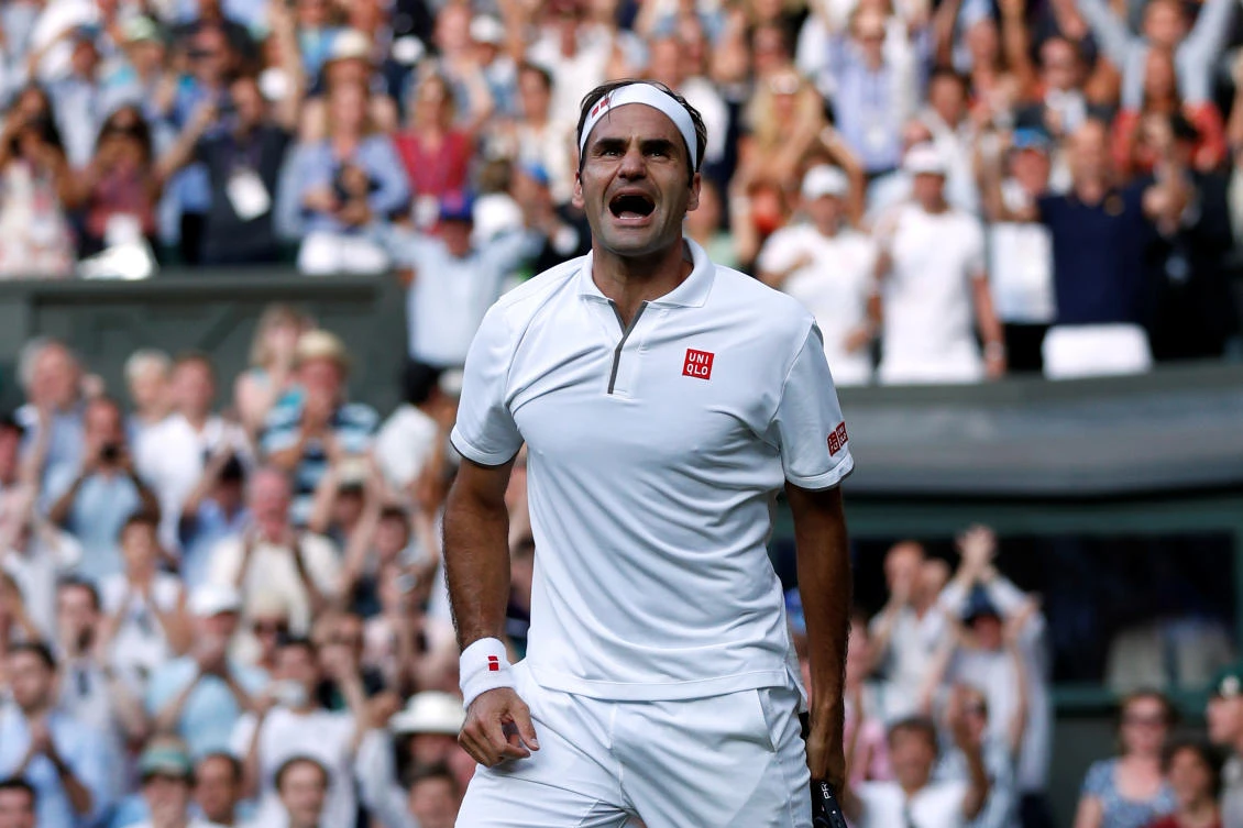Switzerland's Roger Federer celebrates after winning his semifinal match against Spain's Rafael Nadal. (Reuters)