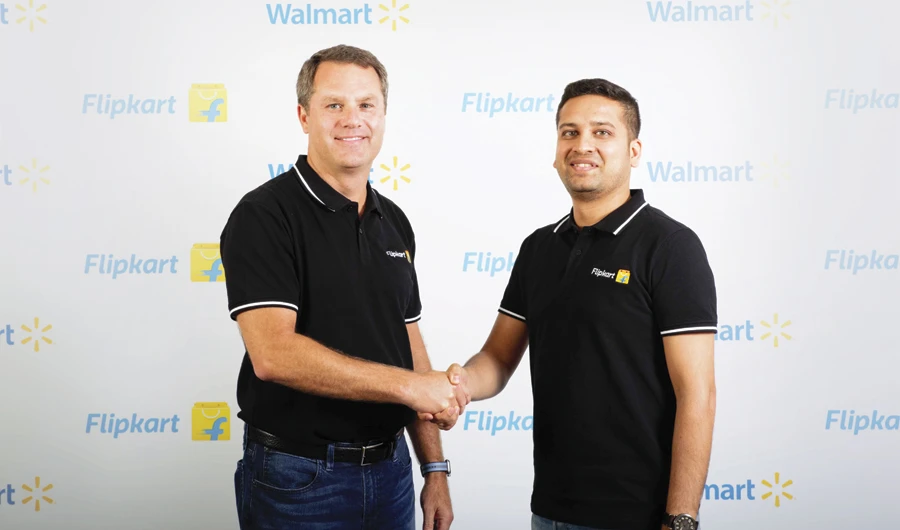 Walmart CEO Doug McMillon, left, and Flipkart CEO Binny Bansal (AFP)