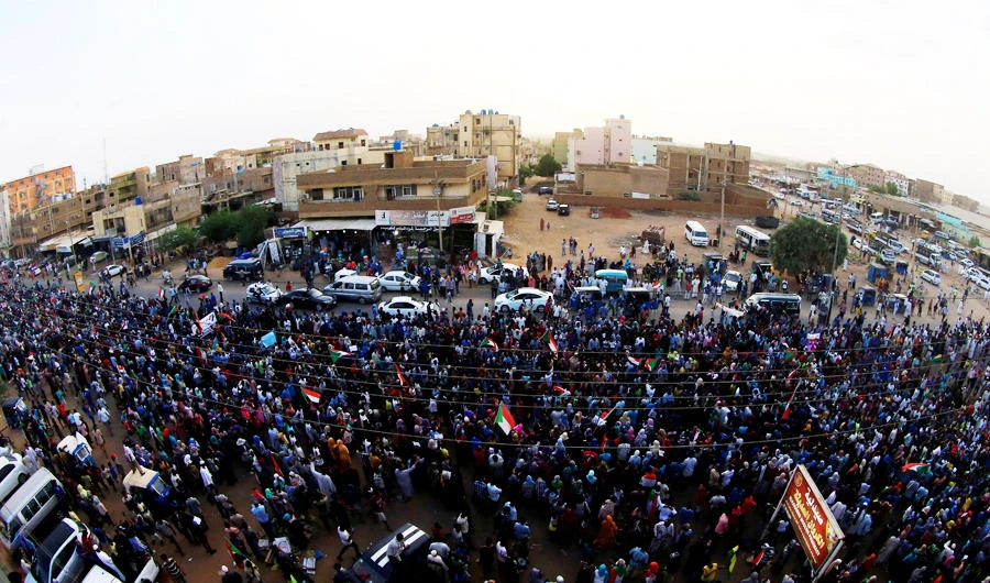 Sudanese protesters march during a demonstration to commemorate 40 days since the sit-in massacre in Khartoum North, Sudan July 13, 2019. (REUTERS)