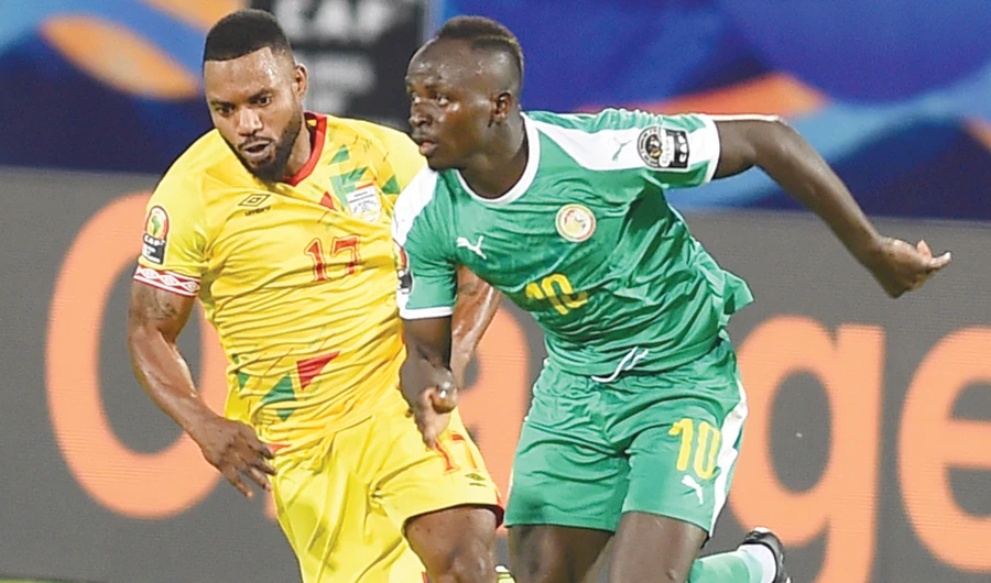 Senegal’s forward Sadio Mane is marked by Benin’s midfielder Stephane Sessegnon during a recent match in Cairo. (AFP)