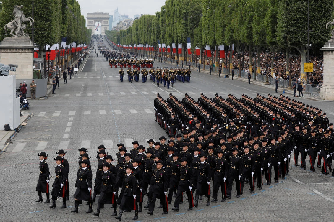 Police fire tear gas to disperse protesters from Champs Elysees after Bastille Day parade