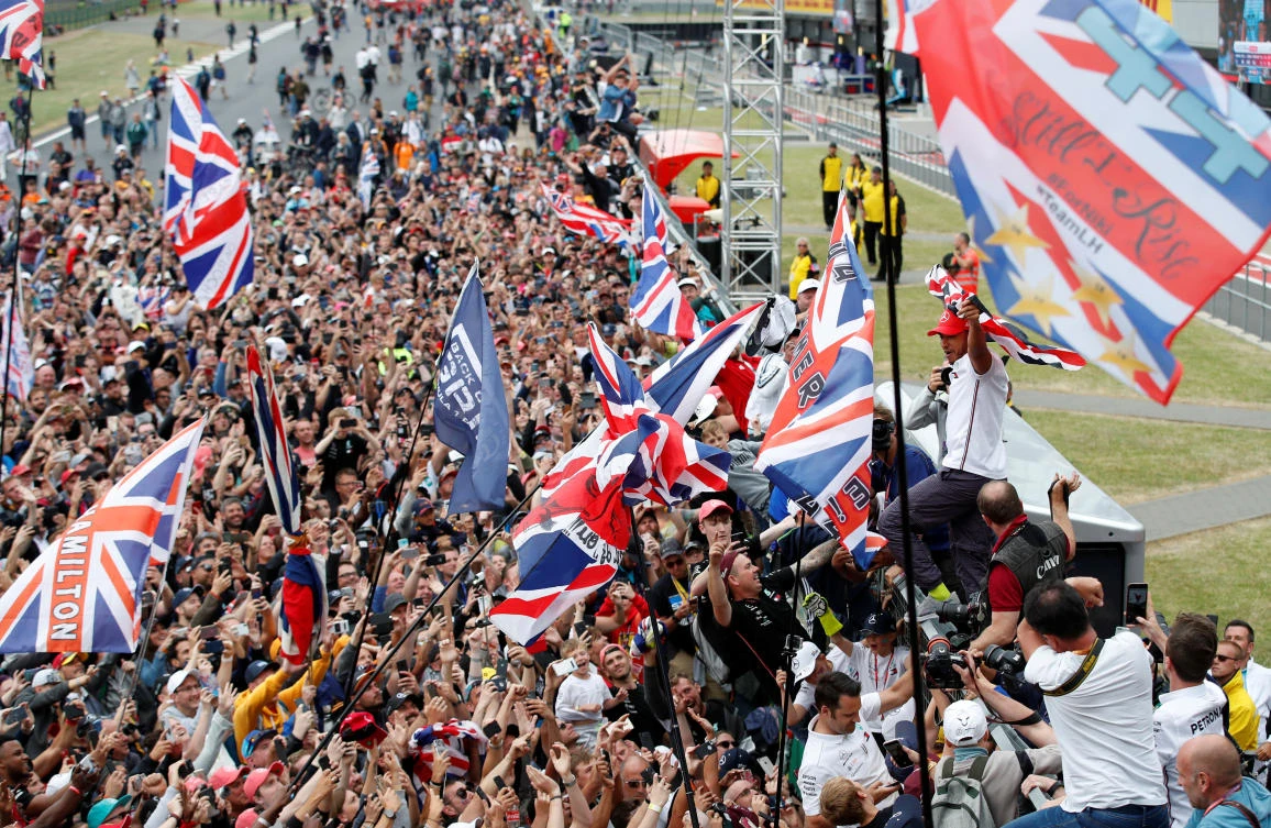 Formula One F1 - British Grand Prix - Silverstone Circuit, Silverstone, Britain - July 14, 2019 Mercedes' Lewis Hamilton celebrates in front of the crowd after winning the race REUTERS/Matthew Childs