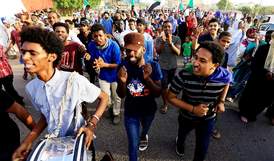 Sudanese protesters march during a demonstration to commemorate 40 days since the sit-in massacre in Khartoum North, Sudan July 13, 2019. (REUTERS)