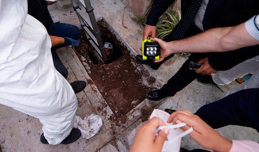 This photo taken and handout on July 11, 2019 by the Vatican Media shows workers and forensics opening one of two tombs within the Vatican's grounds in the Teutonic Cemetery on July 11, 2019, as part of a probe into the case of Emanuela Orlandi, a teenager who disappeared in 1983 in one of Italy's darkest mysteries. (AFP)
