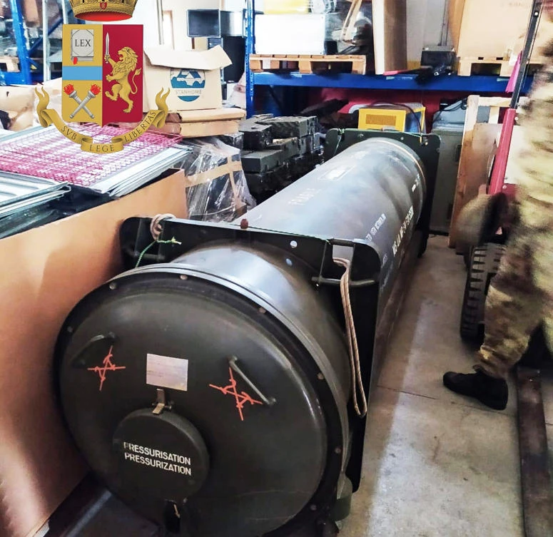 This handout picture released by the Italian police (Polizia di Stato)of Turin, on July 15 2019, shows an air-to-air missile, as part of a big cache of guns and ammunition was seized by the Turin special police force, called Digos, led the operations, assisted by police in Milan, Varese, Forli and Novara. (AFP)