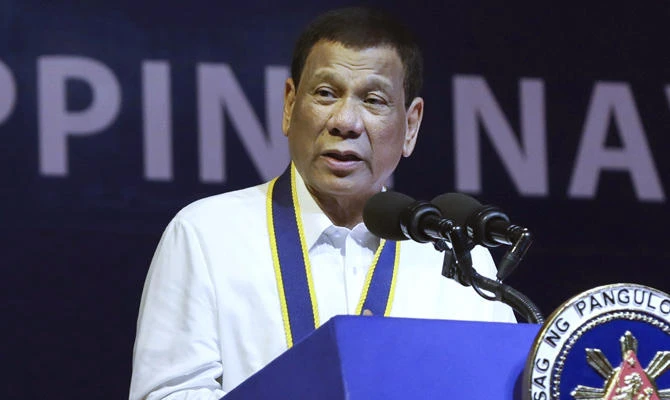 Philippine President Rodrigo Duterte has signed a law against various forms of sexual harassment, including persistent telling of sexual jokes, which pro-women’s groups have accused him of committing. (Malacanang Presidential Photo via AP, File)