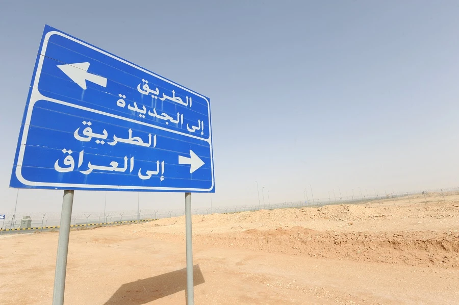 A picture taken on March 12, 2017 shows a road sign reading in Arabic "Road to Jadidah" (TOP) and "Road to Iraq" (BOTTOM), in the area around Arar city along the Saudi-Iraq border. (File/AFP)