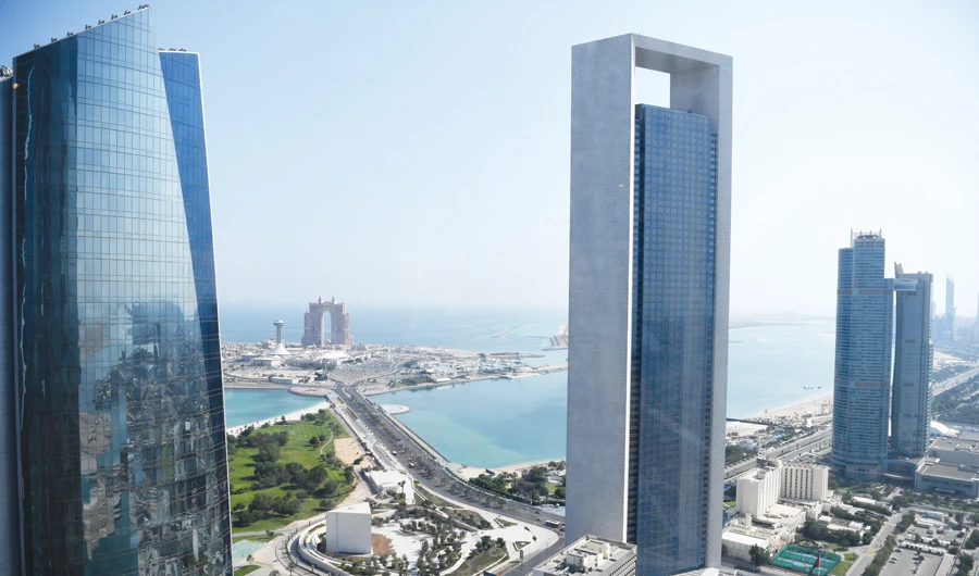 ADNOC headquarters in Abu Dhabi. The company is considering dropping destination restrictions on all of its oil and allowing it to trade freely on the open market. (AFP)