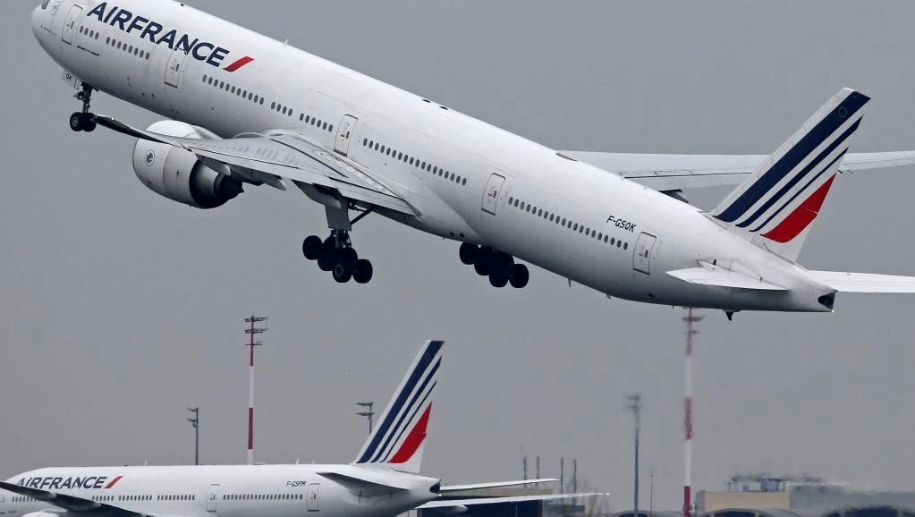 An Air France Airbus Boeing 777 airplane takes off past a control tower at the Charles-de-Gaulle airport in Roissy, near Paris, France, March 23, 2018. (Reuters)