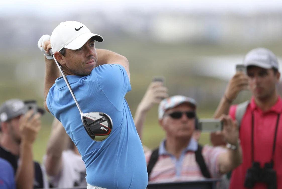 Rory McIlroy plays his tee shot at the 4th during a practice round ahead of the start of the British Open golf championships at Royal Portrush in Northern Ireland. (AP)
