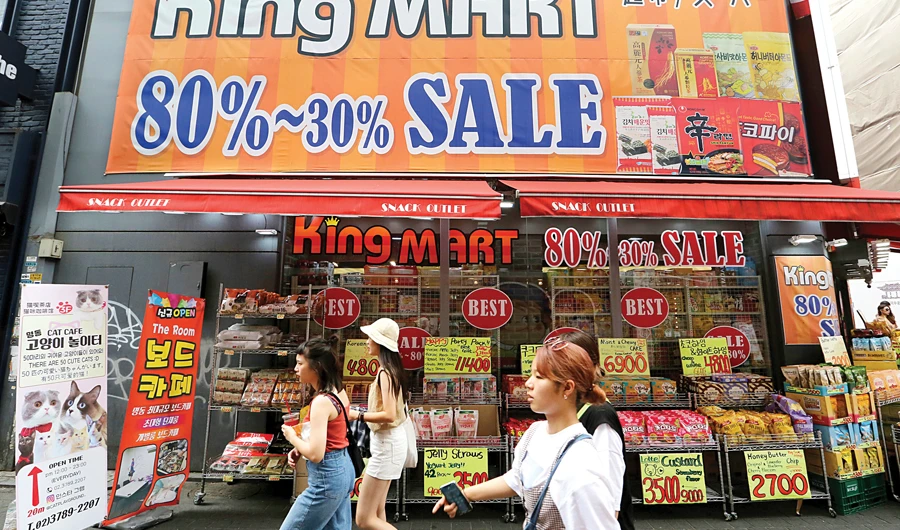 Seoul central bank lowers rate as growth forecast cut