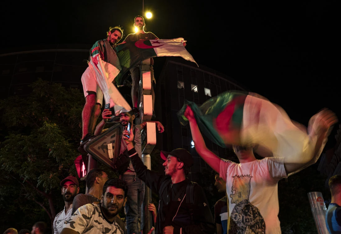 Algerian supporters celebrate in Guillotiere district in Lyon, central eastern France after the victory of their team over Nigeria during the 2019 Africa Cup of Nations (CAN) semi-final football match, on July 14, 2019. (File/AFP)