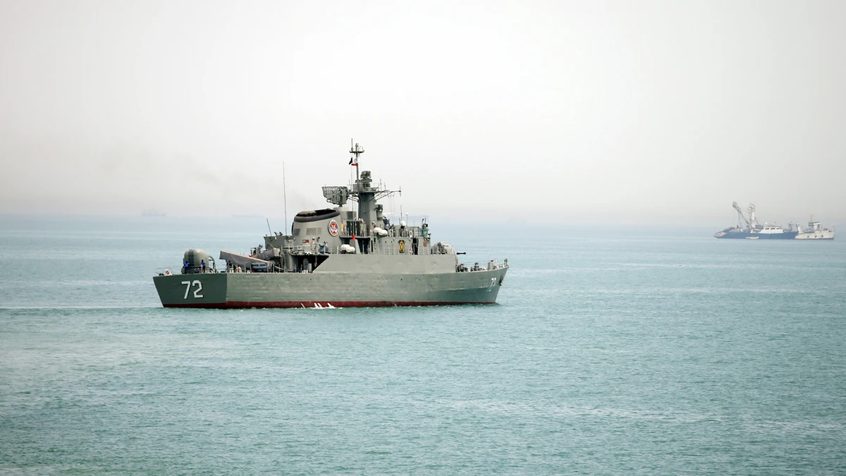 In this picture taken on Tuesday, April 7, 2015, and released by the semi-official Fars News Agency, Iranian warship Alborz, foreground, prepares before leaving Iran's waters, at the Strait of Hormuz. (AP)
