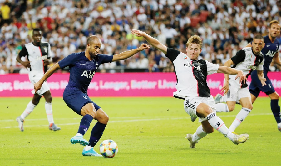 Tottenham's Lucas Moura, left, in action with Juventus' Matthijs de Ligt. (Reuters)