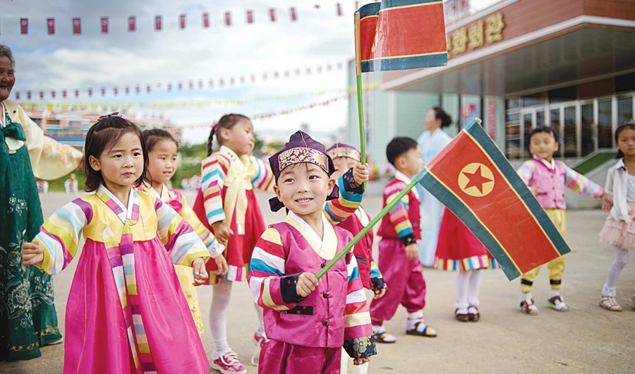 Children perform a dance at a polling station on Sunday during voting for deputies to the Pyongyang City People’s Assembly. (AFP)