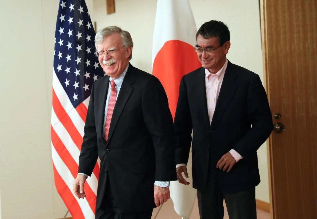 Japan’s Foreign Minister Taro Kono (R) greets US National Security Advisor John Bolton (L) during their meeting in Tokyo on July 22, 2019. (AFP)