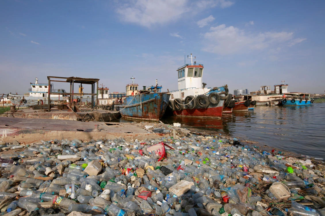 Plastic waste pile up near the shipwrecks at Shatt al-Arab river in Basra, Iraq July 19, 2019. (Reuters)