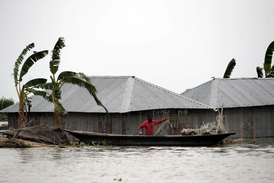 A flood-affected farmer process jute plant in Jamalpur, Bangladesh, July 22, 2019. Picture taken July 22, 2019. (Reuters)