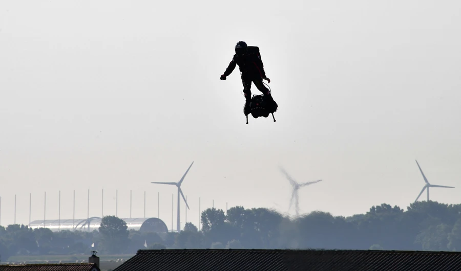 Franky Zapata stands on his jet-powered "flyboard" as he takes off from Sangatte, northern France. (AFP)