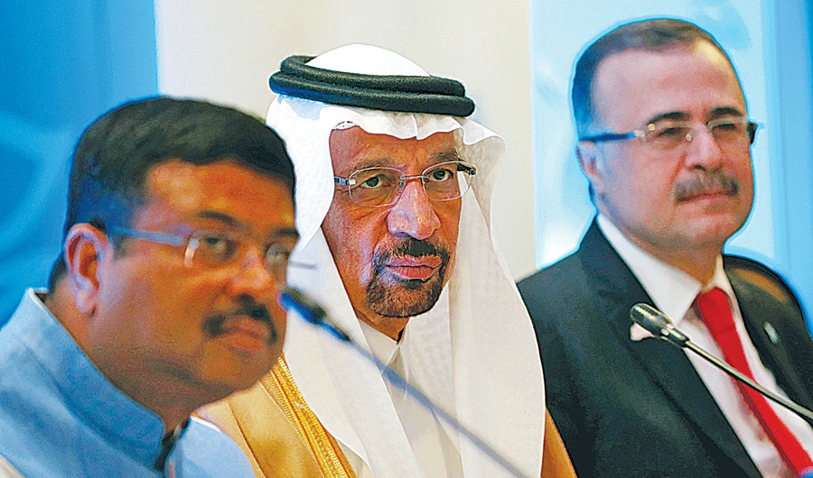Saudi Energy Minister Khalid al-Falih addresses the media flanked by India’s Oil Minister Dharmendra Pradhan and Saudi Aramco Chief Executive Officer Amin Nasser. (Reuters)