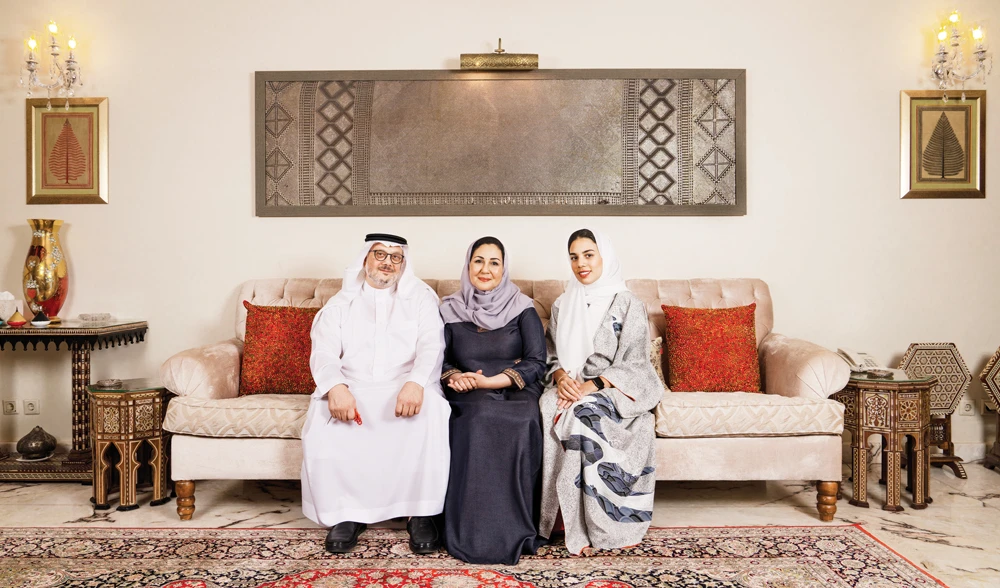 Somaya Badr (center) at her house with her husband and daughter. (AN photo by Ziyad Alarfaj)