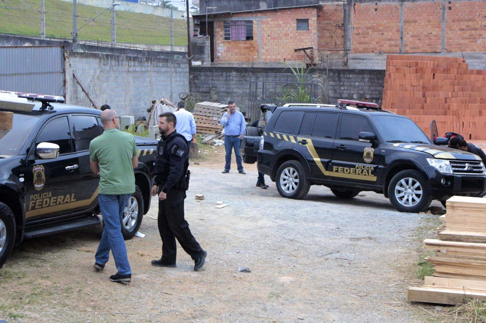 Police inspect the vehicles that were left by suspects involved in heist carried out at Sao Paulo's Guarulhos international airport, in the Jardim Pantanal neighborhood of Sao Paulo, Brazil, on July 25, 2019. (Paulo Lopes/Futura Press via AP)