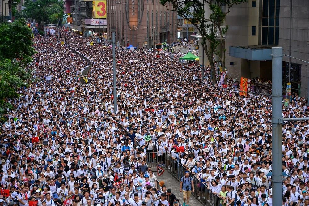 When some protesters retaliated, the beatings escalated as men and women were hit repeatedly on their heads and bodies by the masked men, who wore white shirts. (Shutterstock)
