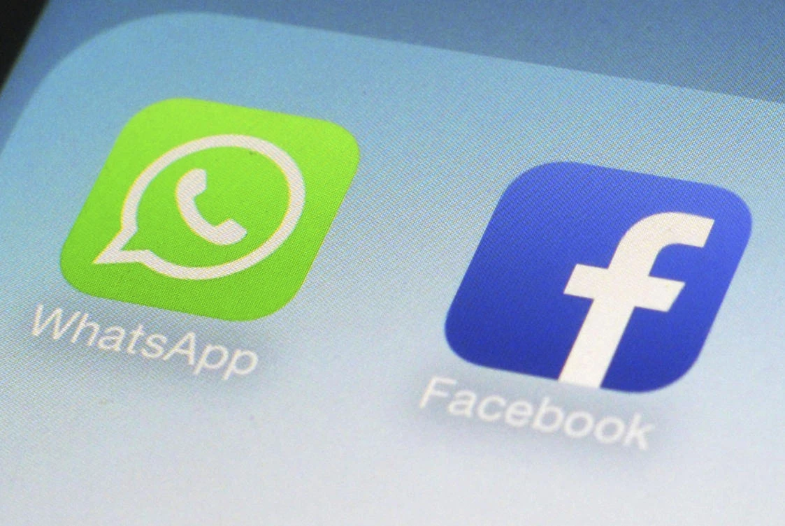 This Feb. 19, 2014, file photo, shows WhatsApp and Facebook app icons on a smartphone in New York. (AP)