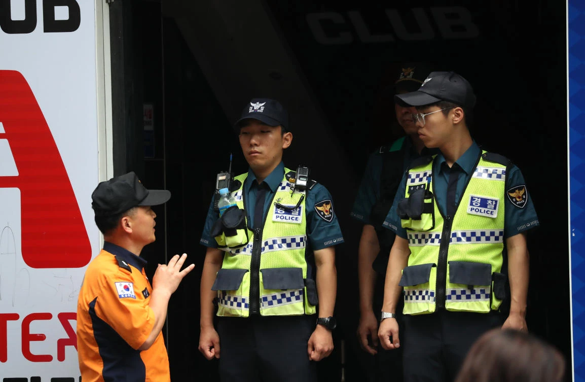 Police secure the area outside a night club after its upper floor collapsed in Gwangju, South Korea. (Reuters)