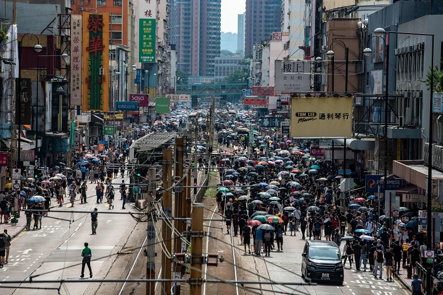 Crowds of Hong Kong protesters defied a police ban and began gathering in a town close to the Chinese border. (AFP)