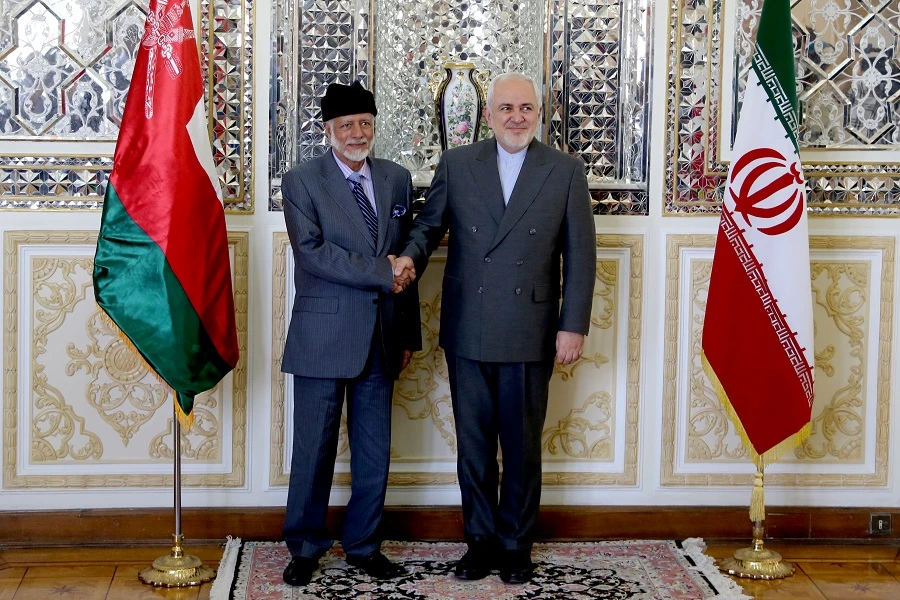 Oman's Minister of State for Foreign Affairs Yousuf bin Alawi bin Abdullah (L) shakes hands with Iran's Foreign Minister Mohammad Javad Zarif in Tehran on July 27, 2019. (AFP)