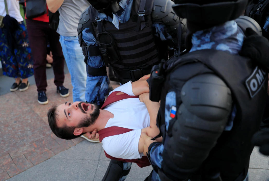Law enforcement officers detain a participant of a rally calling for opposition candidates to be registered for elections to Moscow City Duma, the Russian capital’s regional parliament. (Reuters)