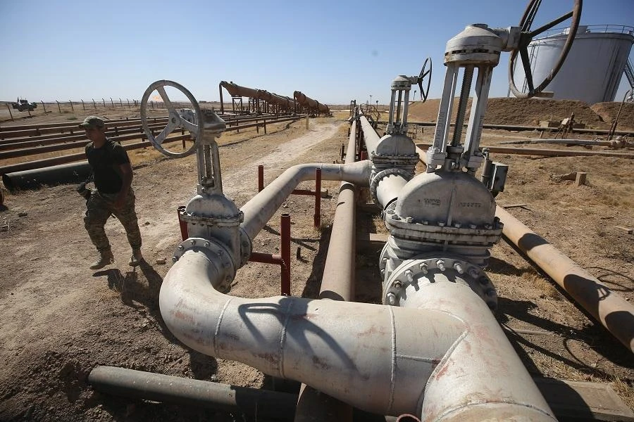 A member of the Iraqi government forces walks through the Bai Hassan oil field, west of the multi-ethnic northern Iraqi city of Kirkuk. (File/AFP)