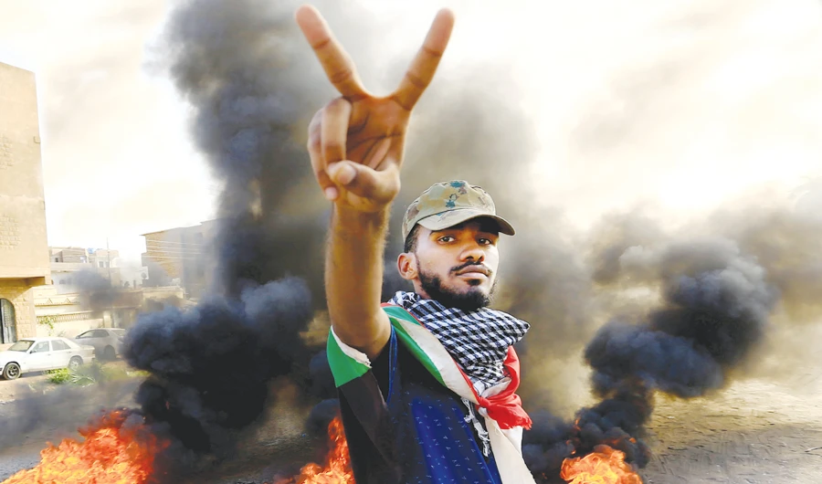 A Sudanese gestures during a rally against the report on the sit-in protest in Khartoum, on Saturday. (Reuters)
