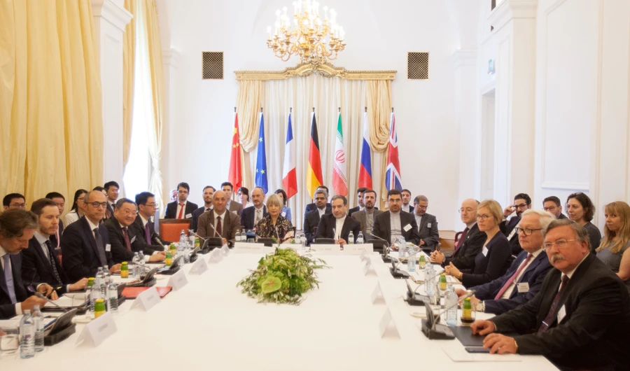 Iran's top nuclear negotiator Abbas Araqchi (Center R) and Helga Schmid (Center L), Secretary-General of the European Union's External Action Service (EEAS), take part in a meeting of the Joint Commission of the Joint Comprehensive Plan of Action (JCPOA) attended by the E3+2 (China, France, Germany, Russia, United Kingdom) and Iran on July 28, 2019 in Vienna, Austria. (AFP / ALEX HALADA)