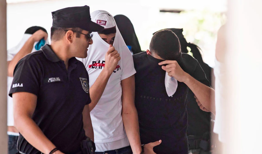 Israeli tourists, suspected of raping a 19-year-old British girl in Ayia Napa, leave the court after a hearing in the eastern Cypriot resort of Paralimni on July 26, 2019. A group of young Israeli tourists appeared again before a Cyprus court after the alleged gang rape of a British teenager in a popular resort. The group of 12 Israelis has not yet been charged, police sources said, later adding that five of them were released on Thursday. / AFP / Iakovos Hatzistavrou