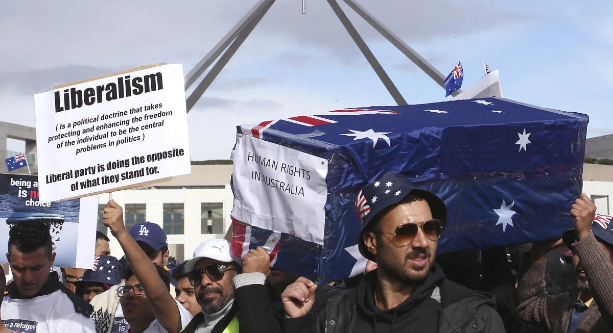 Hundreds of protesters are highlighting the uncertain futures of many refugees since Australia replaced permanent protection visas with temporary visas. (AP)