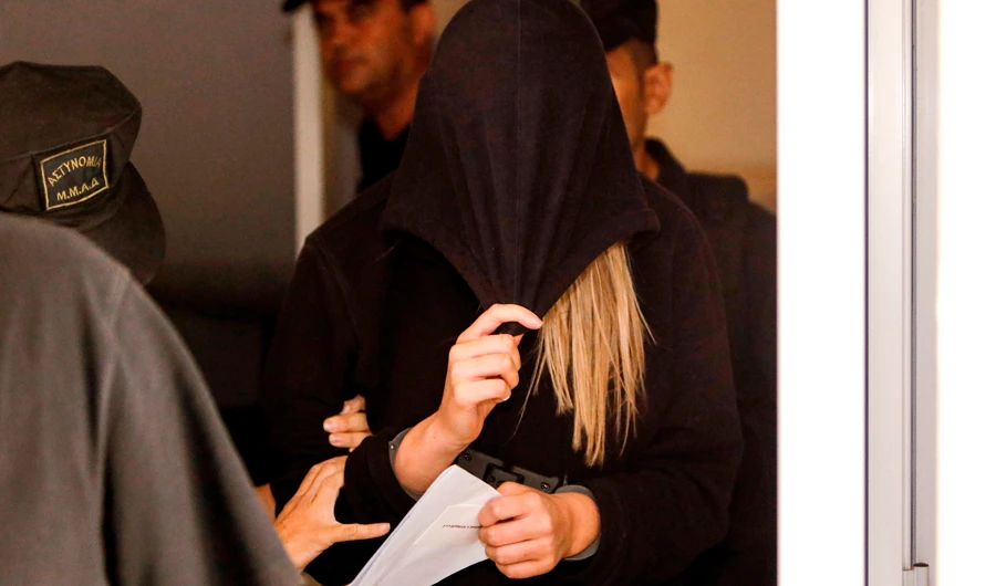 A British teenager who accused seven Israelis of gang rape leaving the Famagusta District Court in Paralimni in eastern Cyprus. (AFP)